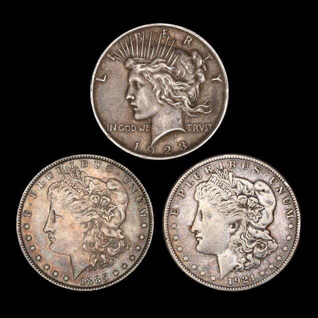 two-morgan-silver-dollars-and-a-peace-dollar