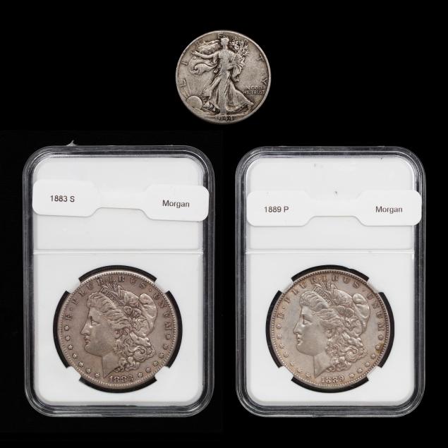 two-morgan-silver-dollars-and-a-walking-liberty-half-dollar
