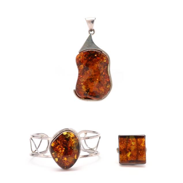 group-of-silver-and-amber-jewelry
