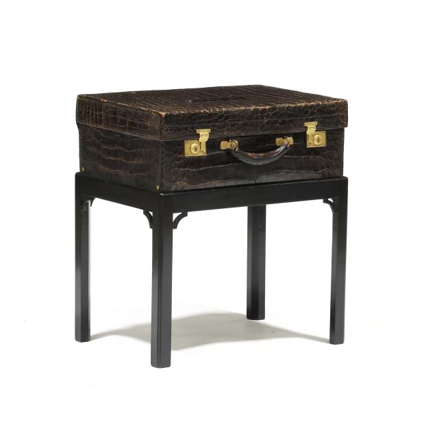 vintage-alligator-suitcase-on-stand