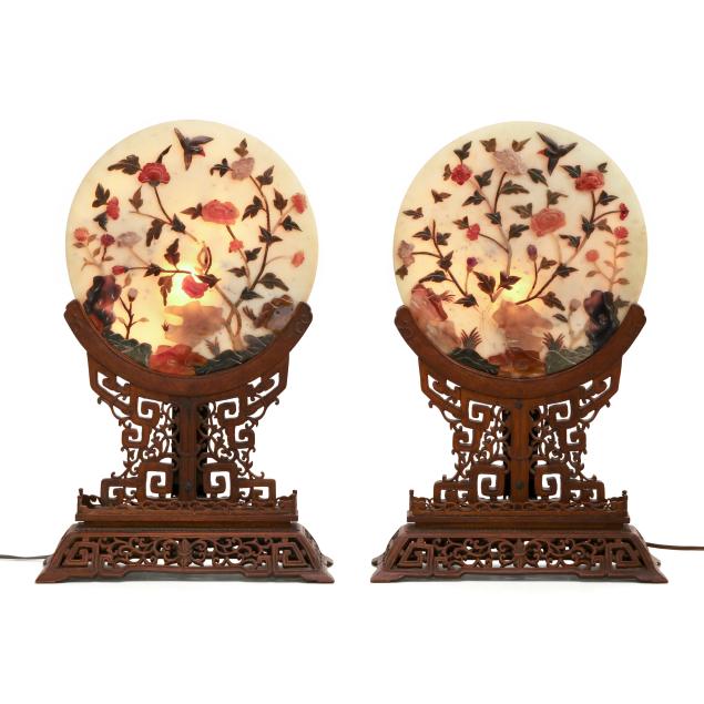 a-pair-of-chinese-circular-jade-panels-with-inlay-in-reticulated-hardwood-stands
