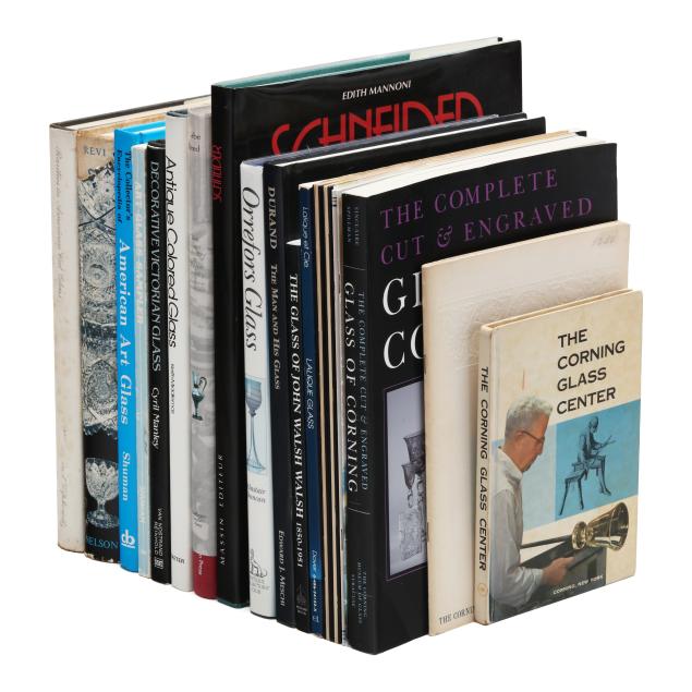 a-large-group-of-books-and-catalogues-on-glass