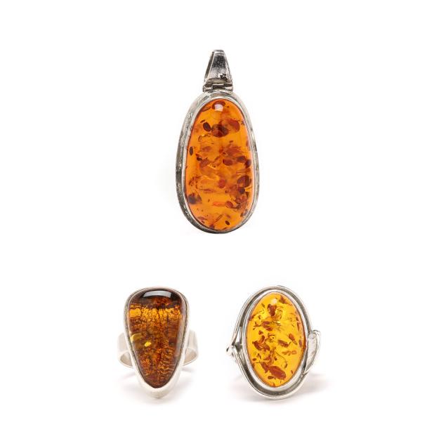 three-silver-and-amber-jewelry-items