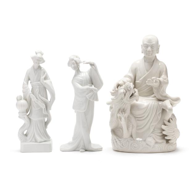 a-group-of-three-asian-porcelain-figurines
