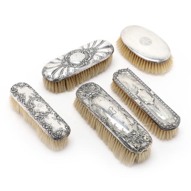 five-sterling-silver-clothes-brushes