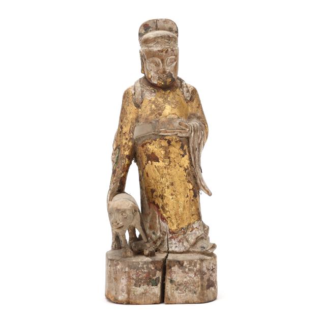 a-chinese-gilt-carved-wood-sculpture-of-an-immortal