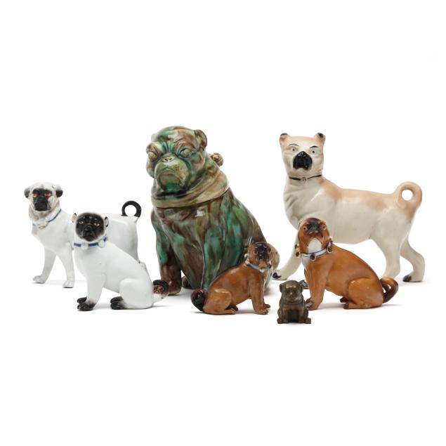 a-collection-of-ceramic-and-brass-cabinet-pug-figurines