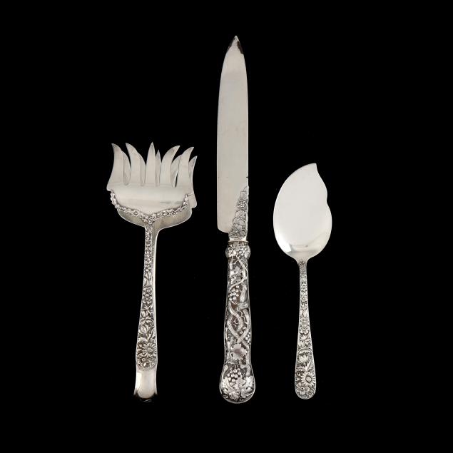 three-silver-serving-pieces-with-relief-decorated-handles