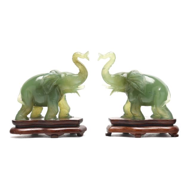 a-pair-of-carved-hardstone-elephants-on-stands