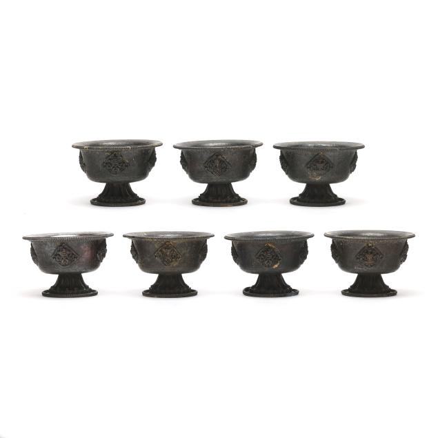 a-group-of-seven-nepalese-copper-stemmed-offering-bowls