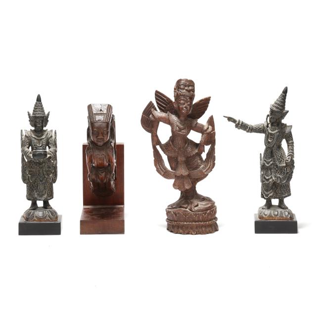 a-group-of-four-southeast-asian-carved-wood-temple-sculptures