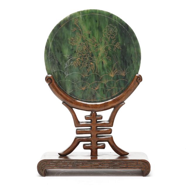a-chinese-gilt-painted-spinach-jade-circular-plaque-set-in-stand