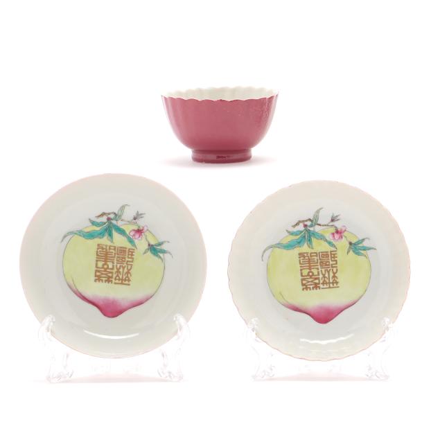 a-chinese-ruby-back-porcelain-peach-longevity-tea-bowl-and-two-saucers
