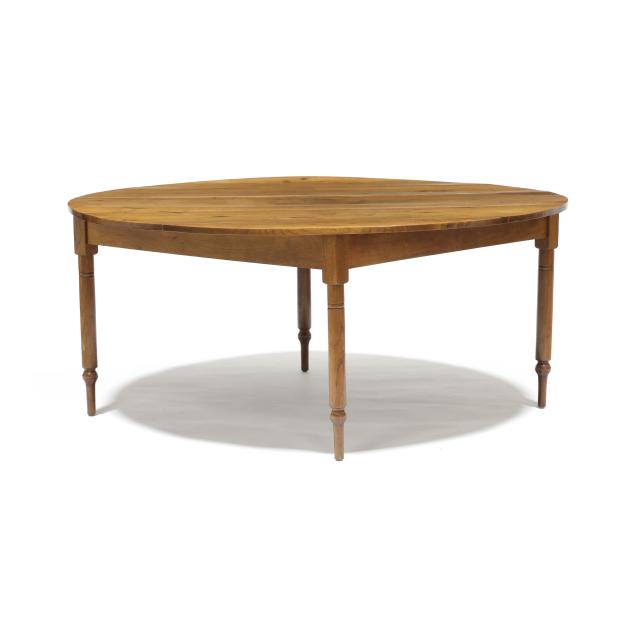 large-round-dining-table-of-antique-walnut