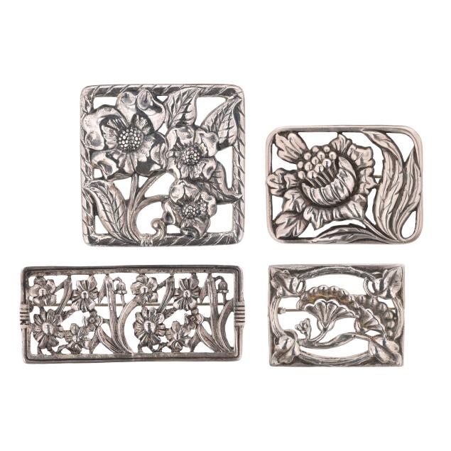 group-of-four-silver-floral-motif-brooches