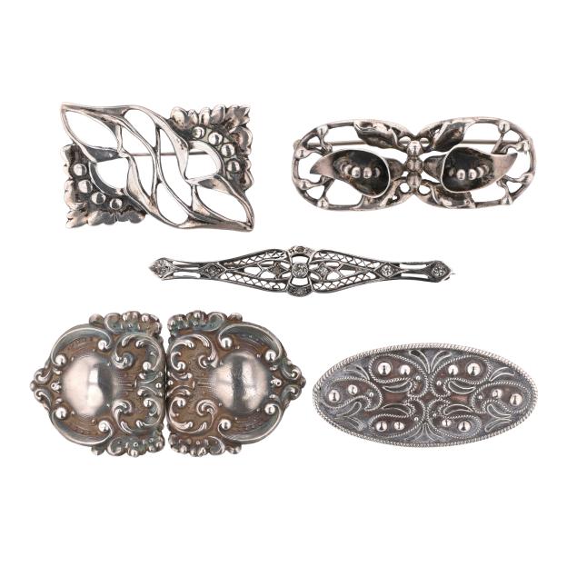 group-of-five-silver-brooches-and-a-silver-buckle