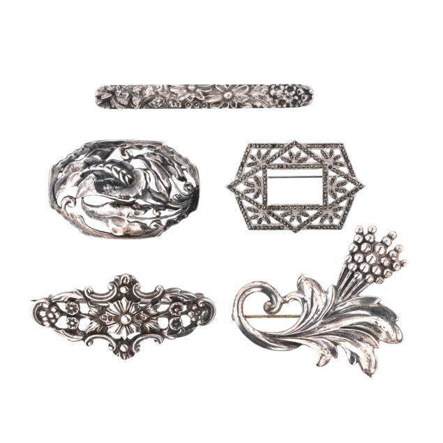 group-of-five-silver-brooches