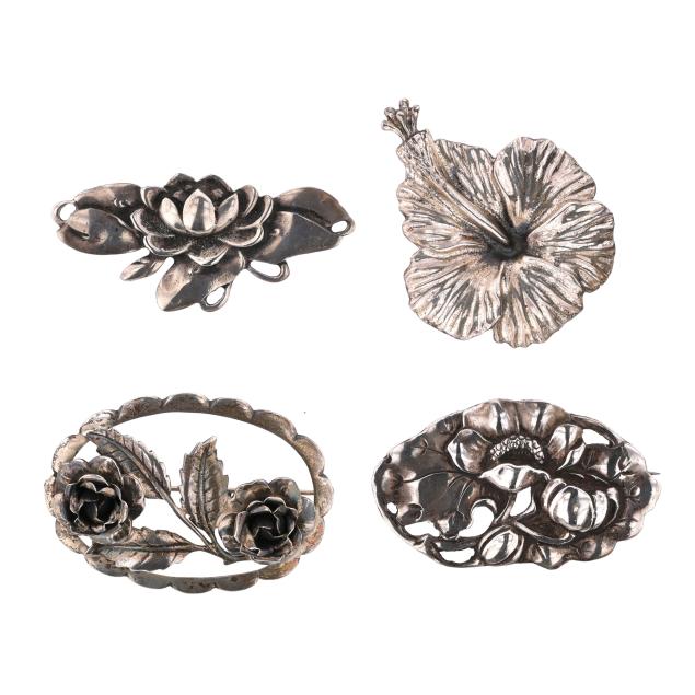 group-of-four-silver-floral-motif-brooches