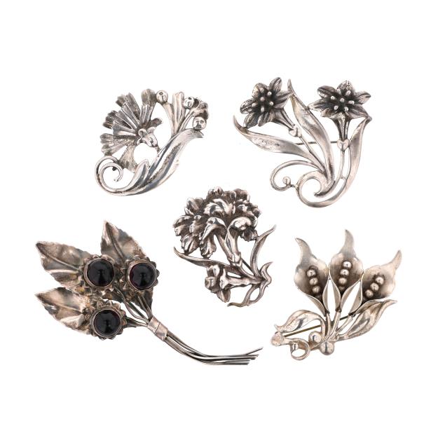 group-of-five-silver-floral-motif-brooches